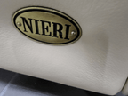 Logo original brand Nieri pe canapea de lux