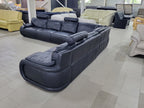 Vedere din spate și lateral a mega colțarului din piele naturală neagră Italsofa MobiHaus